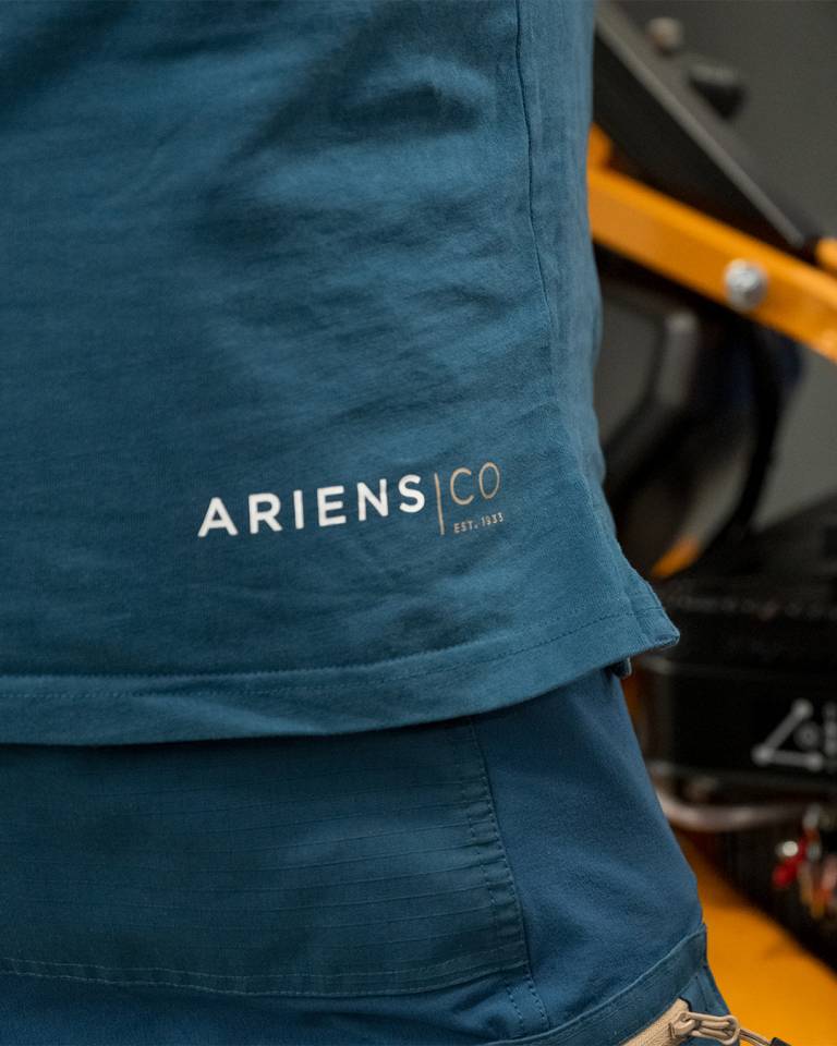Factory worker of AriensCo EMEAA wearing their new turquise work wear inside their factory in Bühlertann, Germany